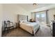Bright bedroom with a large tufted headboard, and neutral tones at 2761 Red Vista Ct, Henderson, NV 89074