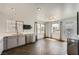 Open dining area with herringbone floors, stainless steel appliances, and lots of natural light at 2761 Red Vista Ct, Henderson, NV 89074