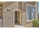 Townhouse front entrance with a stone accent, a welcoming covered doorway, and clean design at 2761 Red Vista Ct, Henderson, NV 89074
