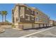 Multi-story building featuring garage doors and a well-maintained exterior at 2761 Red Vista Ct, Henderson, NV 89074