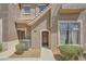 Inviting townhouse entrance with stone accents, tidy landscaping, and covered entryways at 2761 Red Vista Ct, Henderson, NV 89074