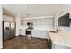 Kitchen with stainless steel appliances, gray cabinetry, white countertops, and herringbone floors at 2761 Red Vista Ct, Henderson, NV 89074