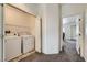 Laundry room with washer, dryer, and closet space, providing convenience at 2761 Red Vista Ct, Henderson, NV 89074