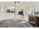 Sunlit living space features high ceilings, neutral carpet, and a modern display at 2761 Red Vista Ct, Henderson, NV 89074