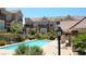 Community pool with lounge chairs surrounded by landscaped grounds at 2761 Red Vista Ct, Henderson, NV 89074