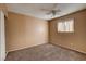 A standard bedroom showcases carpeted floors and natural light at 335 Greenbriar Townhouse Way, Las Vegas, NV 89121