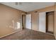 A warm bedroom boasts a ceiling fan, ample storage, and an attached bathroom at 335 Greenbriar Townhouse Way, Las Vegas, NV 89121