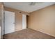 A cozy bedroom offers neutral walls, soft carpeting, and a walk-in closet at 335 Greenbriar Townhouse Way, Las Vegas, NV 89121