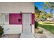 Front entrance of the house with a security door, house number, and well-maintained landscaping at 335 Greenbriar Townhouse Way, Las Vegas, NV 89121