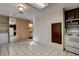 Kitchen providing access to the laundry area and half bath, complete with appliances at 335 Greenbriar Townhouse Way, Las Vegas, NV 89121
