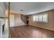 Spacious living room features hardwood floors, a fireplace, a staircase, and ample natural light at 335 Greenbriar Townhouse Way, Las Vegas, NV 89121