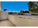 A private patio offers community views surrounded by mature trees at 335 Greenbriar Townhouse Way, Las Vegas, NV 89121