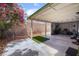 Relaxing covered patio with charming trees and foliage perfect for outdoor enjoyment at 3617 Walnut Wood St, Las Vegas, NV 89129