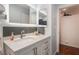 Bathroom featuring a white vanity with storage and modern sink, mirror, and lighting at 3617 Walnut Wood St, Las Vegas, NV 89129