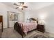 Cozy bedroom with ceiling fan, carpeted floors, and ample natural light at 3617 Walnut Wood St, Las Vegas, NV 89129