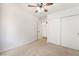 Bedroom featuring neutral carpet, closet with sliding doors, and a ceiling fan at 3617 Walnut Wood St, Las Vegas, NV 89129