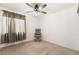 Bedroom featuring neutral carpet, ceiling fan with lighting and sheer curtains at 3617 Walnut Wood St, Las Vegas, NV 89129