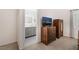 Bedroom with TV and an ensuite bathroom featuring granite vanity and ample storage at 3617 Walnut Wood St, Las Vegas, NV 89129