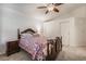 Comfortable bedroom featuring carpeted floors, ceiling fan, and closet at 3617 Walnut Wood St, Las Vegas, NV 89129