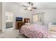 Bright bedroom with ensuite bathroom, carpeted floors, and a ceiling fan at 3617 Walnut Wood St, Las Vegas, NV 89129