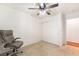 Bedroom featuring neutral carpet, a ceiling fan, and a closet with sliding doors at 3617 Walnut Wood St, Las Vegas, NV 89129