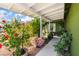 Charming front porch adorned with lush greenery and vibrant flowers at 3617 Walnut Wood St, Las Vegas, NV 89129