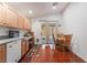 Charming kitchen with wood cabinets, granite countertops and breakfast nook for casual dining at 3617 Walnut Wood St, Las Vegas, NV 89129