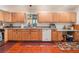 Spacious kitchen with wood cabinets, counter space, and complementary tile flooring at 3617 Walnut Wood St, Las Vegas, NV 89129