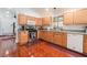 Functional kitchen featuring wood cabinetry, granite countertops, and stainless steel appliances at 3617 Walnut Wood St, Las Vegas, NV 89129