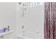 Bathroom featuring a combined bathtub and shower with modern white tile and decorative curtain at 3632 Julia Waldene Ct, Las Vegas, NV 89129