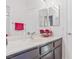 Bathroom vanity with double sinks, flowers, pink towel and modern faucet at 3632 Julia Waldene Ct, Las Vegas, NV 89129