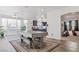 Open-concept living area with lots of natural light and wood flooring at 3632 Julia Waldene Ct, Las Vegas, NV 89129