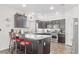Modern kitchen with stainless steel appliances, granite countertops and a cozy breakfast bar at 3632 Julia Waldene Ct, Las Vegas, NV 89129