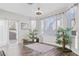 Bright living room with wood floors, houseplants, and natural light at 3632 Julia Waldene Ct, Las Vegas, NV 89129