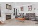 Living room with fireplace, plush seating, movie posters and coffee table at 3632 Julia Waldene Ct, Las Vegas, NV 89129