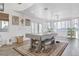 Bright living room featuring a large window, indoor plants and wood flooring at 3632 Julia Waldene Ct, Las Vegas, NV 89129