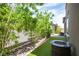 Secluded backyard retreat with a fire pit, manicured landscaping and a privacy fence at 3698 Regatta Landing Dr, Las Vegas, NV 89141