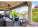 Cozy covered patio with comfortable seating and an outdoor fireplace, perfect for relaxing at 3698 Regatta Landing Dr, Las Vegas, NV 89141