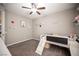 Bright bedroom featuring a unique bed with a slide, playful decor, and a ceiling fan at 3698 Regatta Landing Dr, Las Vegas, NV 89141