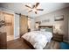 Bedroom features wood look flooring and a sliding barn door leading to the bathroom at 3698 Regatta Landing Dr, Las Vegas, NV 89141
