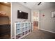 Bedroom with organized storage, a TV, and decor that leads to a glimpse of the staircase at 3698 Regatta Landing Dr, Las Vegas, NV 89141