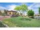 Beautiful community park featuring a covered gazebo, lush green lawn and mature landscaping at 3698 Regatta Landing Dr, Las Vegas, NV 89141