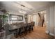 Dining area features a wooden table, decorative mirror, built-in shelving, and stylish chandelier at 3698 Regatta Landing Dr, Las Vegas, NV 89141