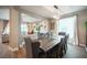 Dining room boasts a large table, comfortable chairs, and access to a bright living area at 3698 Regatta Landing Dr, Las Vegas, NV 89141