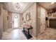 Elegant entryway with marble floors, console table, and decorative lighting fixtures at 3698 Regatta Landing Dr, Las Vegas, NV 89141