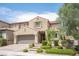 Inviting two-story home boasts well-maintained landscaping and warm exterior colors at 3698 Regatta Landing Dr, Las Vegas, NV 89141
