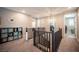 Upstairs hallway featuring modern fixtures, built-in shelving, and stylish finishes at 3698 Regatta Landing Dr, Las Vegas, NV 89141