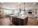 Kitchen island view highlights granite counters, a stainless steel dishwasher, and pendant lighting at 3698 Regatta Landing Dr, Las Vegas, NV 89141