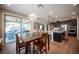 Kitchen featuring stainless steel appliances, an island and easy access to both the dining and living areas at 3698 Regatta Landing Dr, Las Vegas, NV 89141