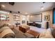 Bright Gathering room featuring a projector screen, comfortable seating, and decorative shelving at 3698 Regatta Landing Dr, Las Vegas, NV 89141